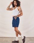 Side view of Denim Trouser Shorts in Dark Wash and Cropped Tank in vintage tee off-white on Jesse