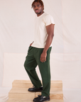 Side view of Easy Pants in Swamp Green and Organic Vintage Tee in Vintage Tee Off-White on Issac