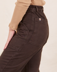 Side close up of Work Pants in Espresso Brown worn by Soraya