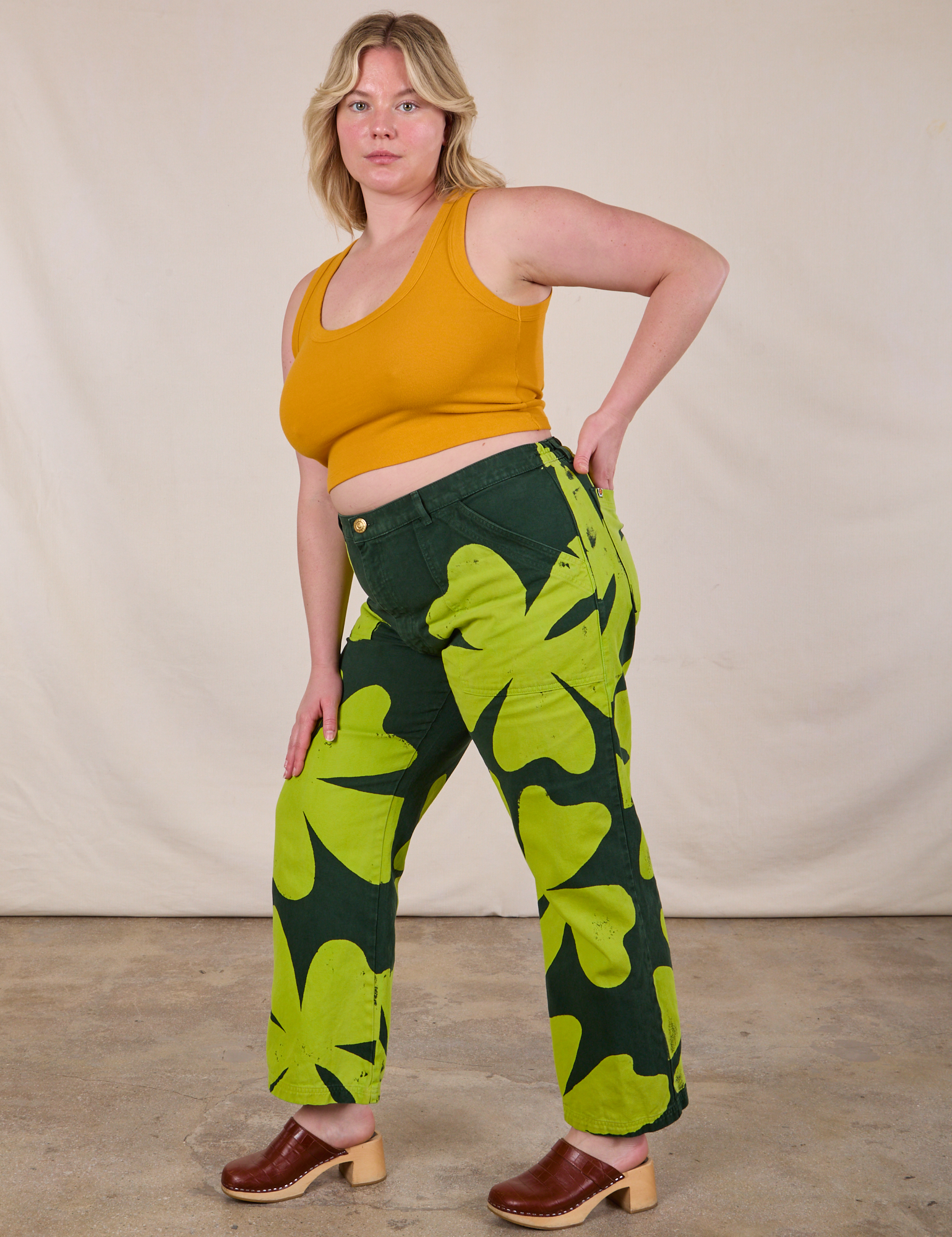 Side view of Paintstamped Clover Work Pant and Mustard Yellow Cropped Tank on Lish