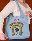 Shopper Tote in Golden Horseshoe worn over Lish's shoulder