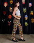 Side view of Work Pants in Halloween Masks and Cropped Tank in Vintage Tee White on Alex