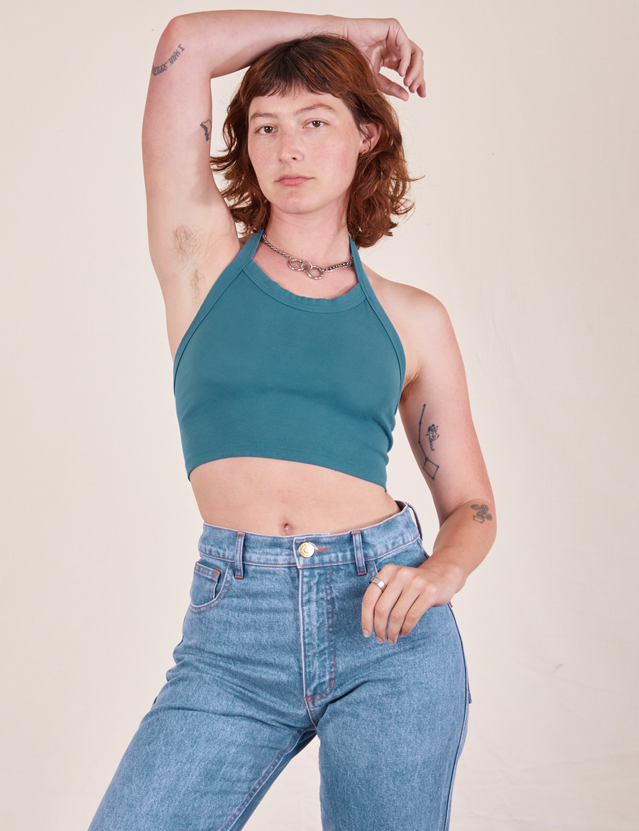 Alex is wearing Halter Top in Marine Blue and light wash Frontier Jeans