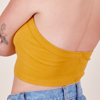 Back close up of Halter Top in Mustard Yellow worn by Alex