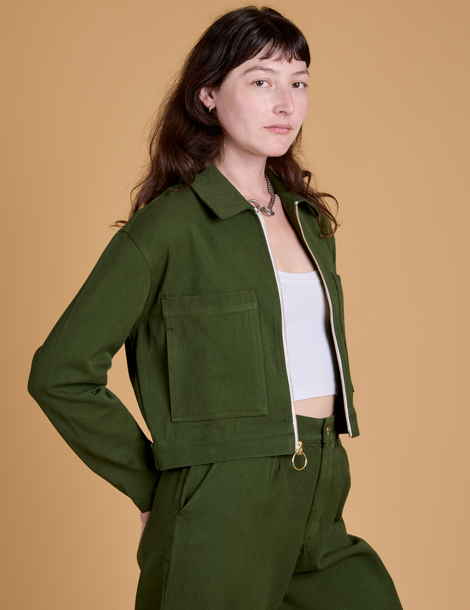 Angled front view of Heritage Mechanic Jacket in Evergreen on Alex