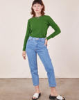 Alex is wearing Honeycomb Thermal in Lawn Green tucked into light wash Frontier Jeans