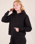 Oversized Hoodie in Basic Black angled front view on Margaret