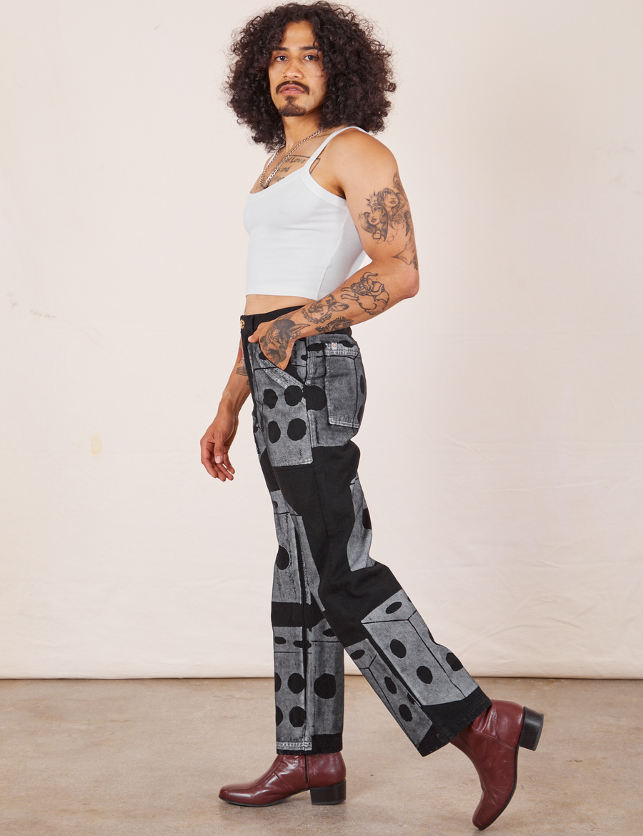 Side view of Icon Work Pants in Dice and vintage off-white Cropped Cami worn by Jesse