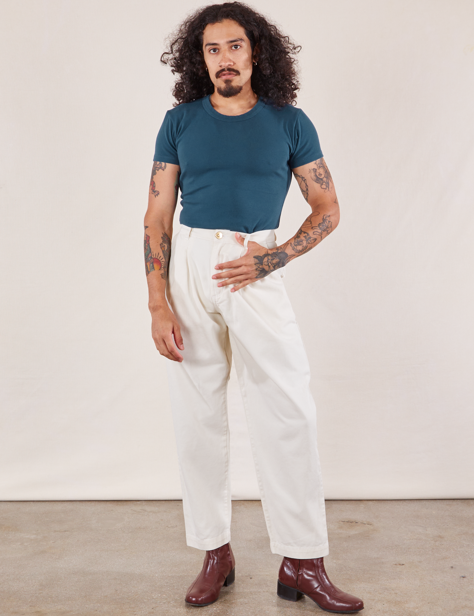 Jesse is wearing Baby Tee in Lagoon and vintage tee off-white Heavyweight Trousers