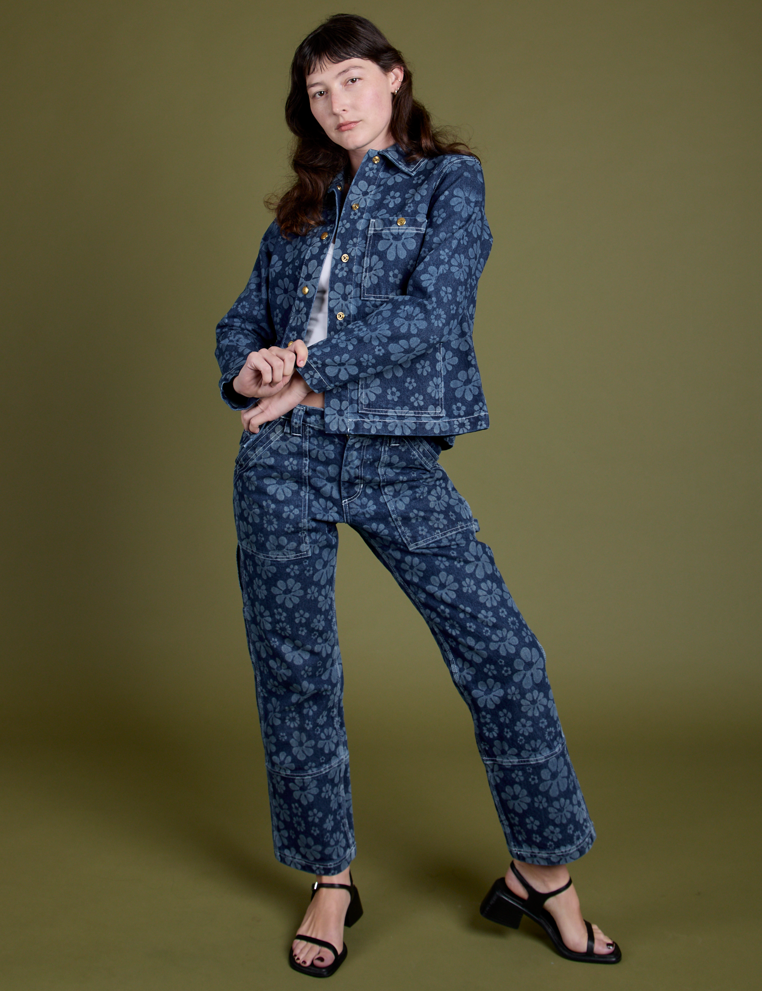 Alex is wearing Lazy Daisy Work Jacket and matching Mid-Rise Carpenter Jeans