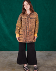Hana is wearing Field Coat in Leopard Print and black Bell Bottoms