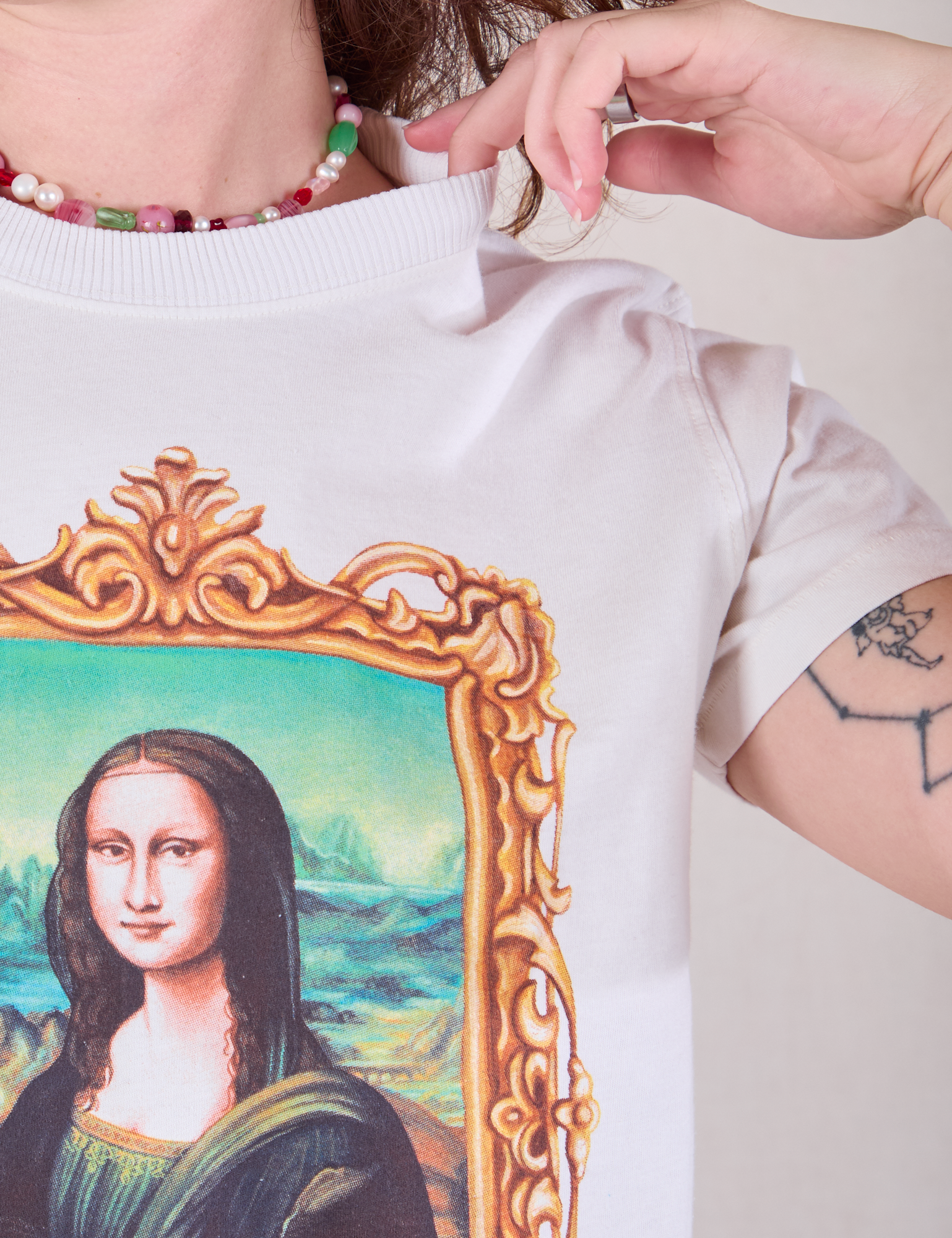 Masters Organic Tee in Mona Lisa front close up on Alex