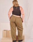 Back view of Mid-Rise Pleated Trousers in Desert Brown and espresso brown Cropped Tank in Juliet