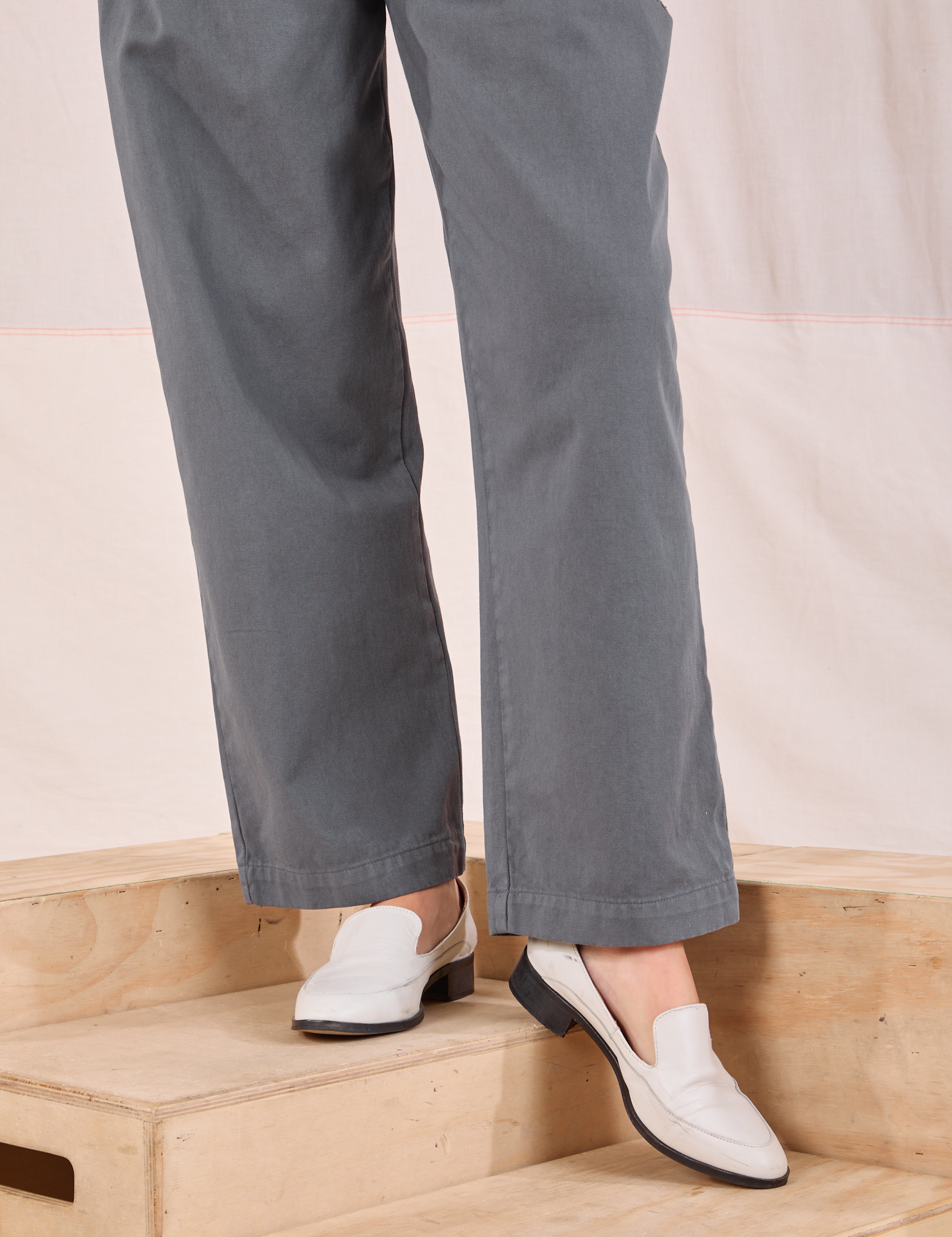 Mid-Rise Pleated Trousers in Slate Grey pant leg close up on Alex