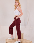 Side view of Mid-Rise Work Pants in Red Wine and Cropped Tank in vintage tee off-white on Margaret