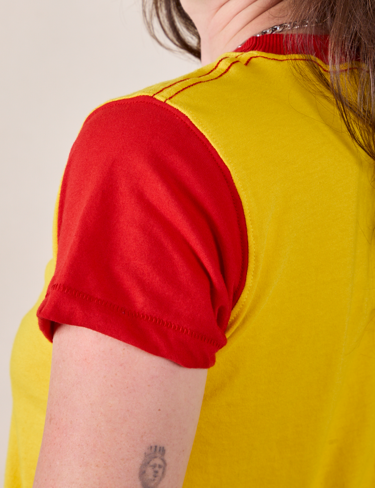 Mismatched Tee in Yellow &amp; Red sleeve close up on Alex