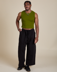 Isaac is wearing Muscle Tee in Summer Olive paired with black Drop Pocket Cargo Pants