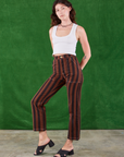 Angled front view of Black Stripe Work Pants in Fudgesicle Brown and Cropped Tank on Alex