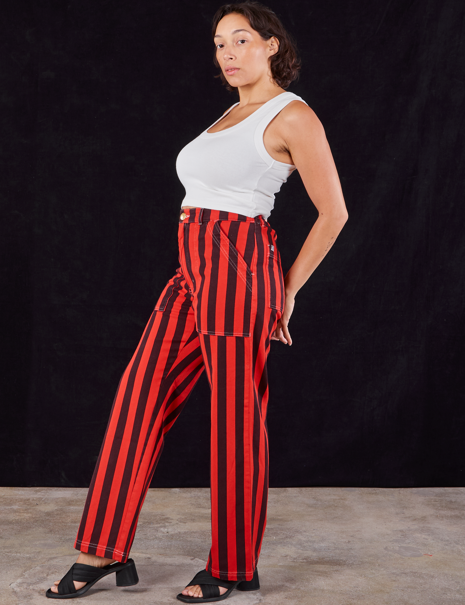 Side view of Black Stripe Work Pants in Mustang Red and Cropped Tank in vintage tee off-white on Tiara