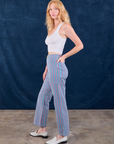 Side view of Stripe Work Pants in Blue Raspberry and Cropped Tank in vintage tee off-white on Margaret