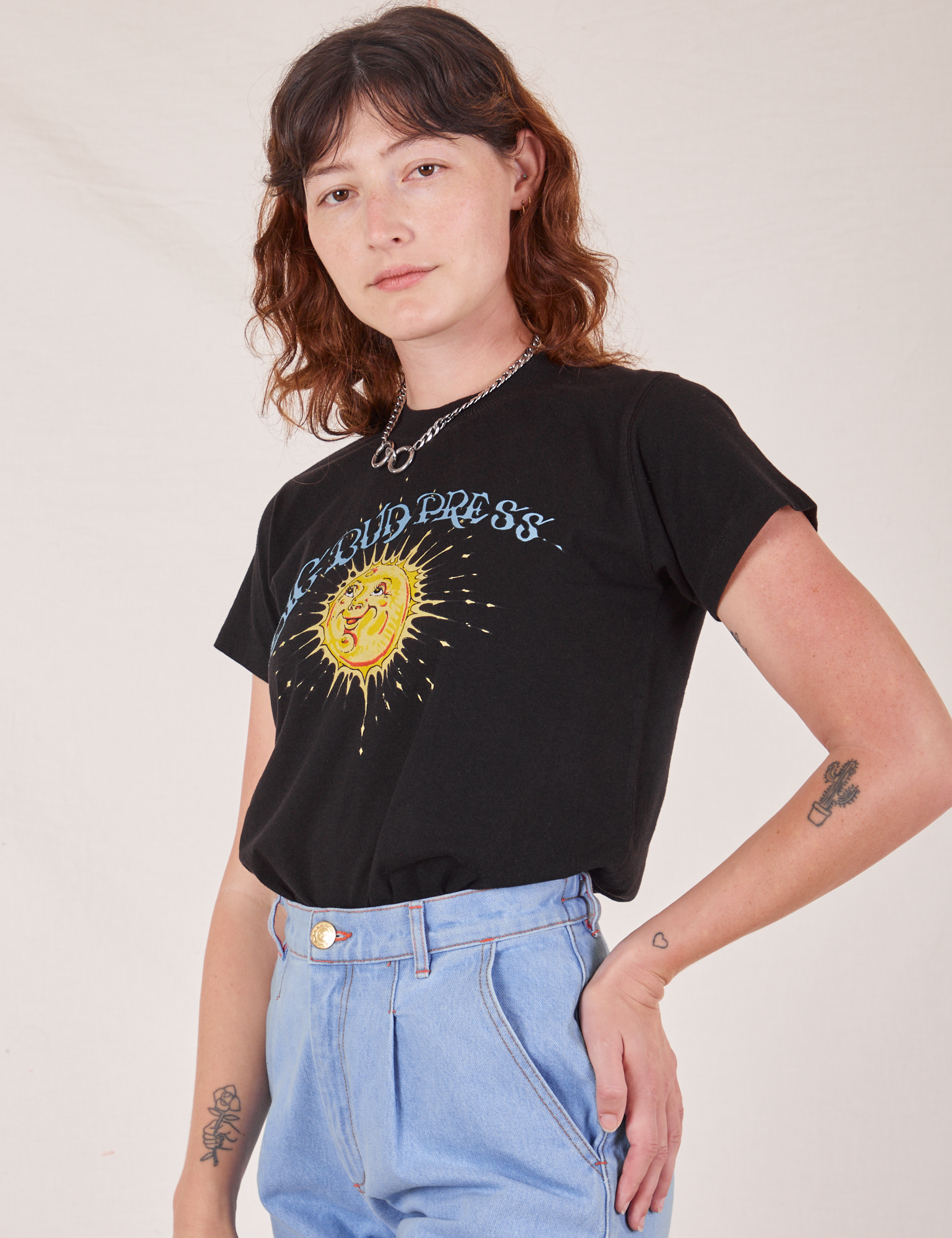 Sun Baby Organic Tee in Basic Black angled front view on Alex