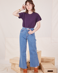 Hana is wearing The Organic Vintage Tee in Nebula Purple and light wash Sailor Jeans