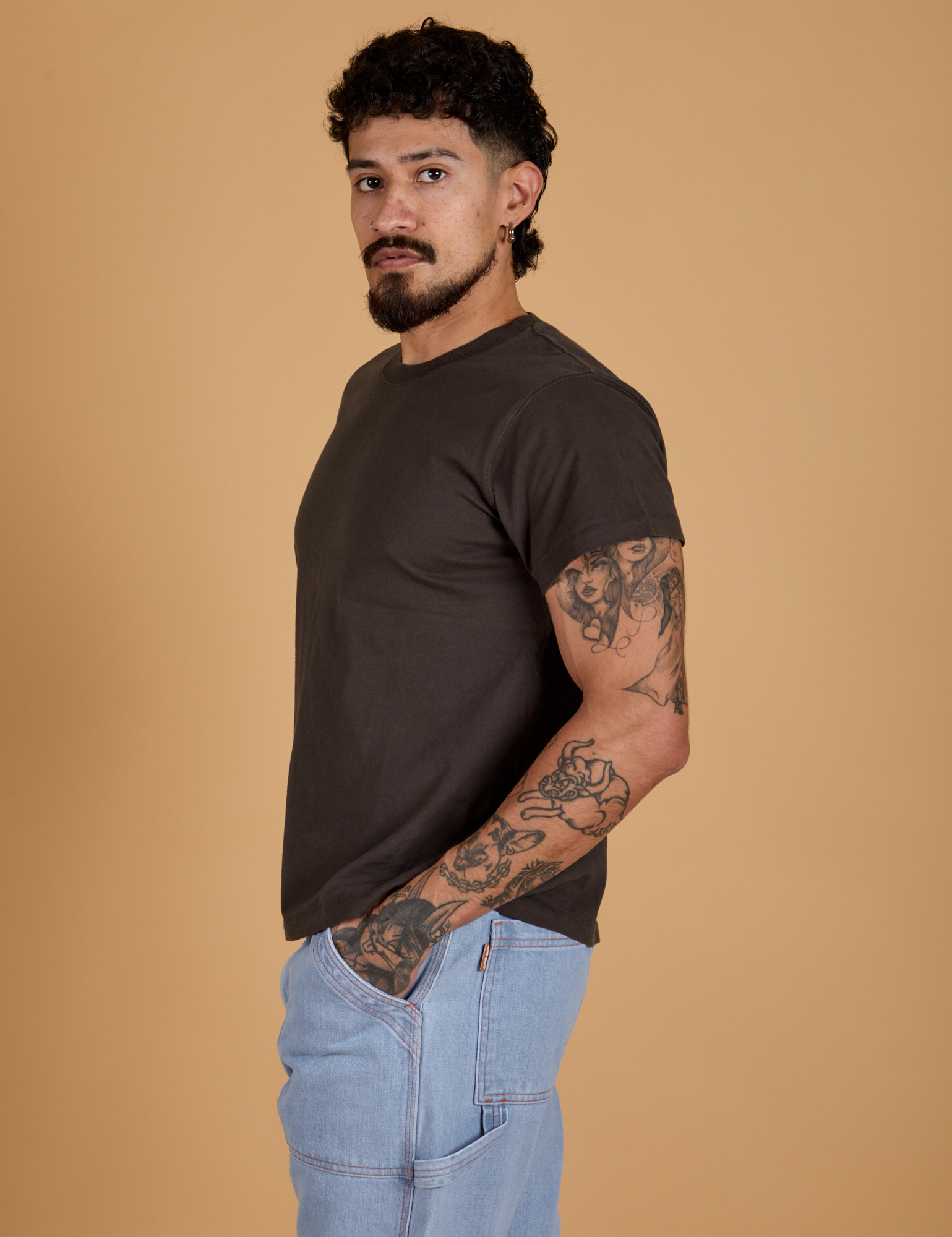 Angled front view of Organic Vintage Tee in Espresso Brown on Jesse