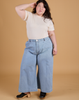 Ashley is wearing Organic Vintage Tee in Vintage Off White tucked into light wash Indigo Wide Leg Trousers