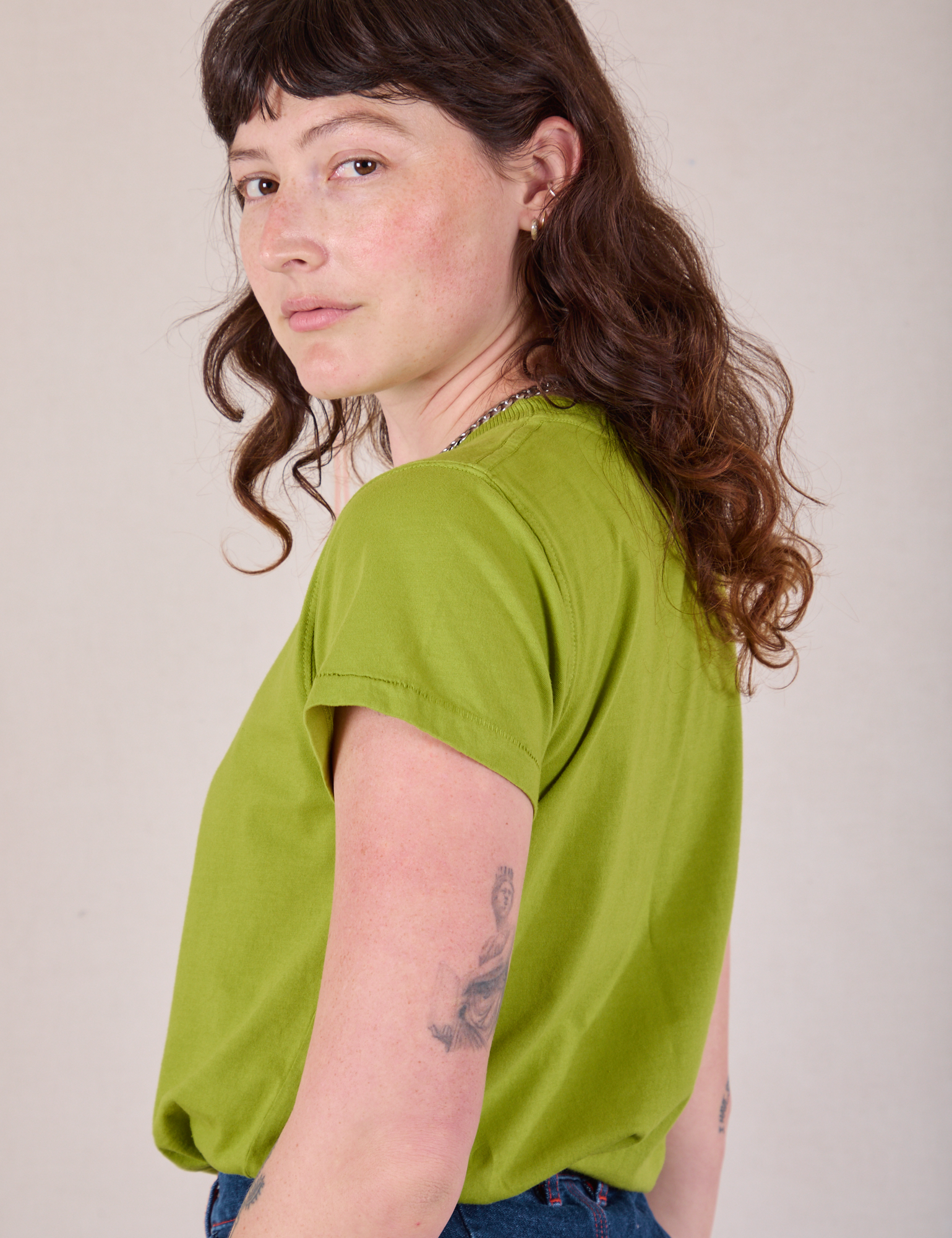 Organic Vintage Tee in Gross Green side view on Alex