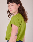 Organic Vintage Tee in Gross Green side view on Alex