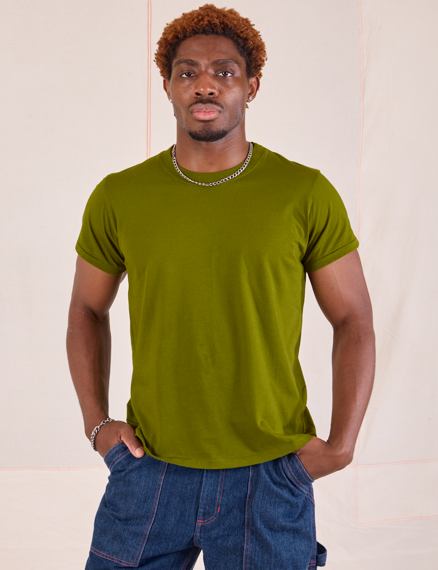 Issac is wearing Organic Vintage Tee in Summer Olive