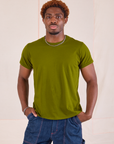 Issac is wearing Organic Vintage Tee in Summer Olive