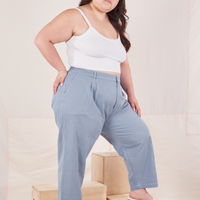 Side view of Organic Trousers in Periwinkle and vintage off-white Cami worn by Ashley