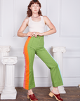 Alex is 5'8" and wearing XS Hand-Painted Stripe Western Pants in Bright Olive paired with a vintage off-white Tank Top