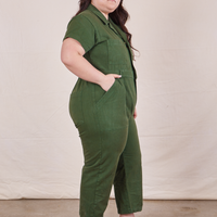 Petite Short Sleeve Jumpsuit in Dark Emerald Green side view on Ashley