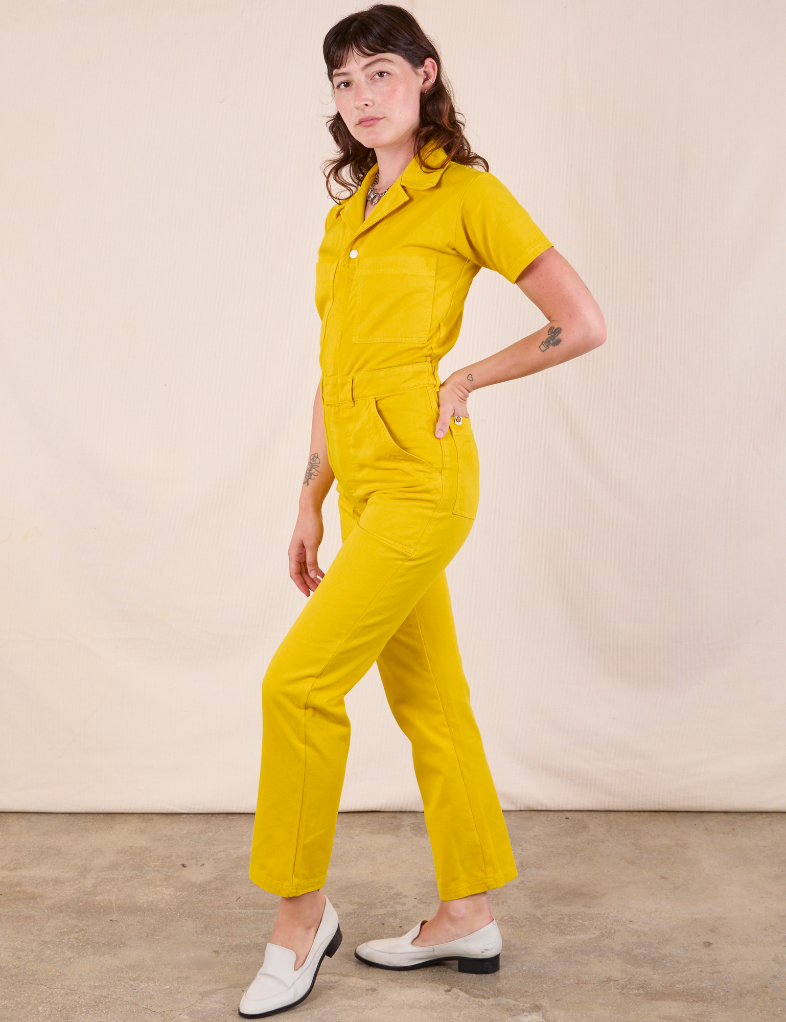 Short Sleeve Jumpsuit in Golden Yellow side view on Alex