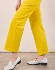 Work Pants in Golden Yellow pant leg close up on Alex