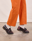 Work Pants in Construction Orange pant leg close up on Quinn