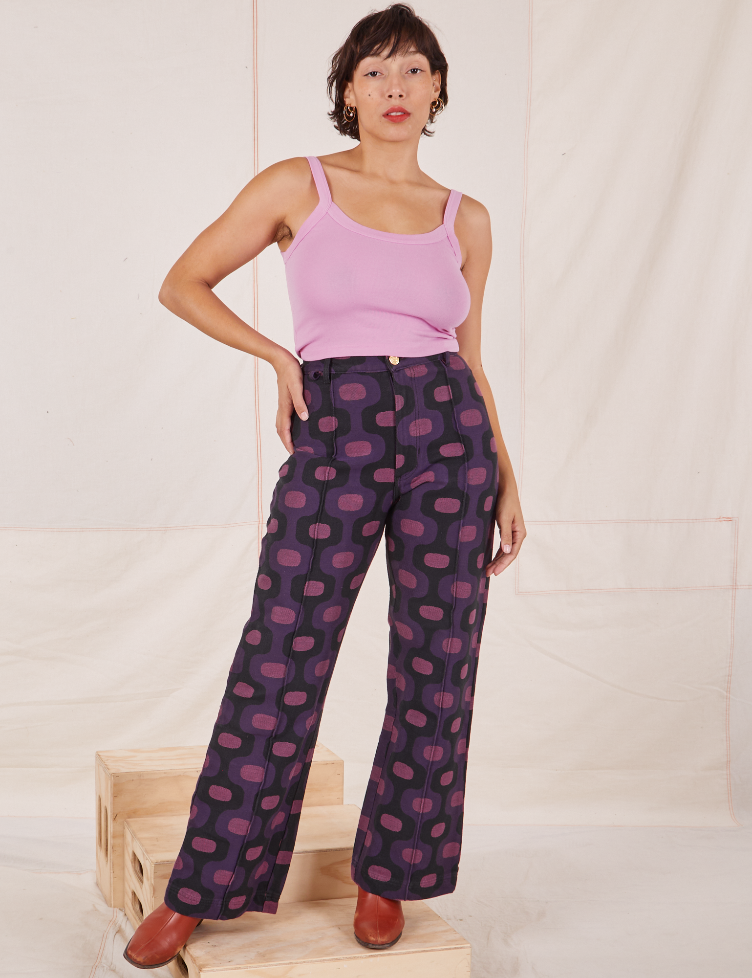 Tiara is wearing Western Pants in Purple Tile Jacquard and bubblegum pink Cami
