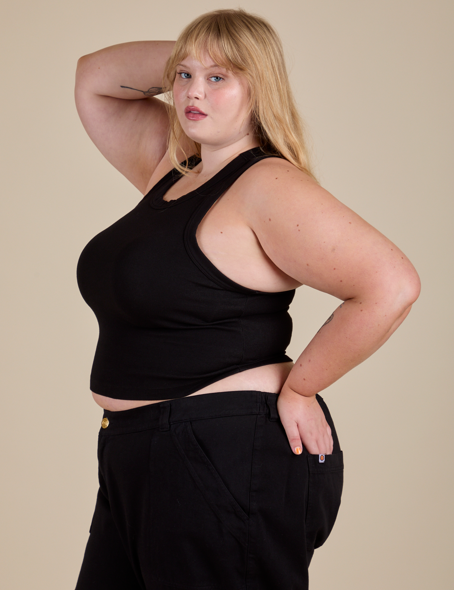 Racerback Tank in Black angled front view of Racerback Tank in Black on Juliet