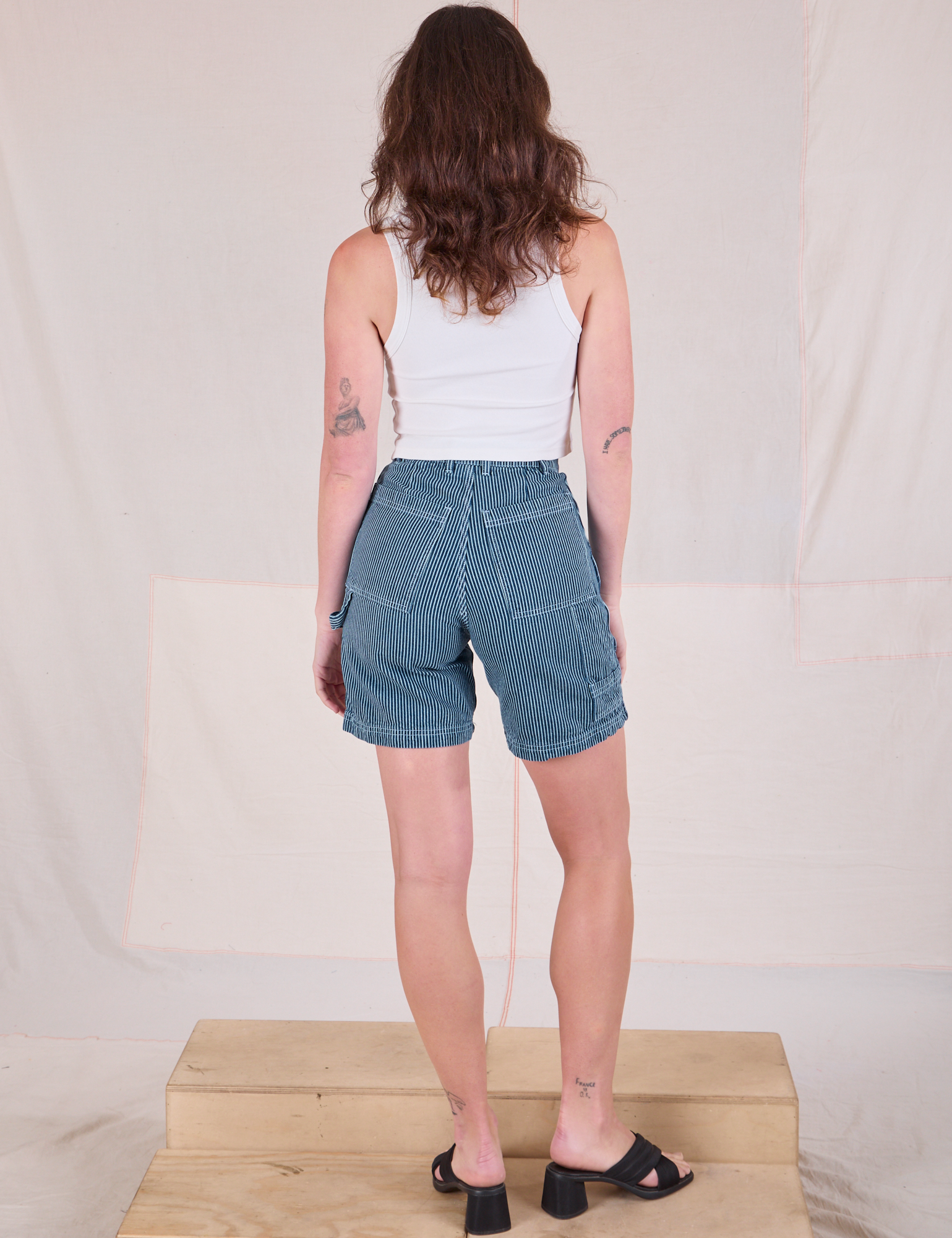 Back view of Railroad Carpenter Shorts in Baby Blue and Cropped Tank in Vintage Tee Off-White