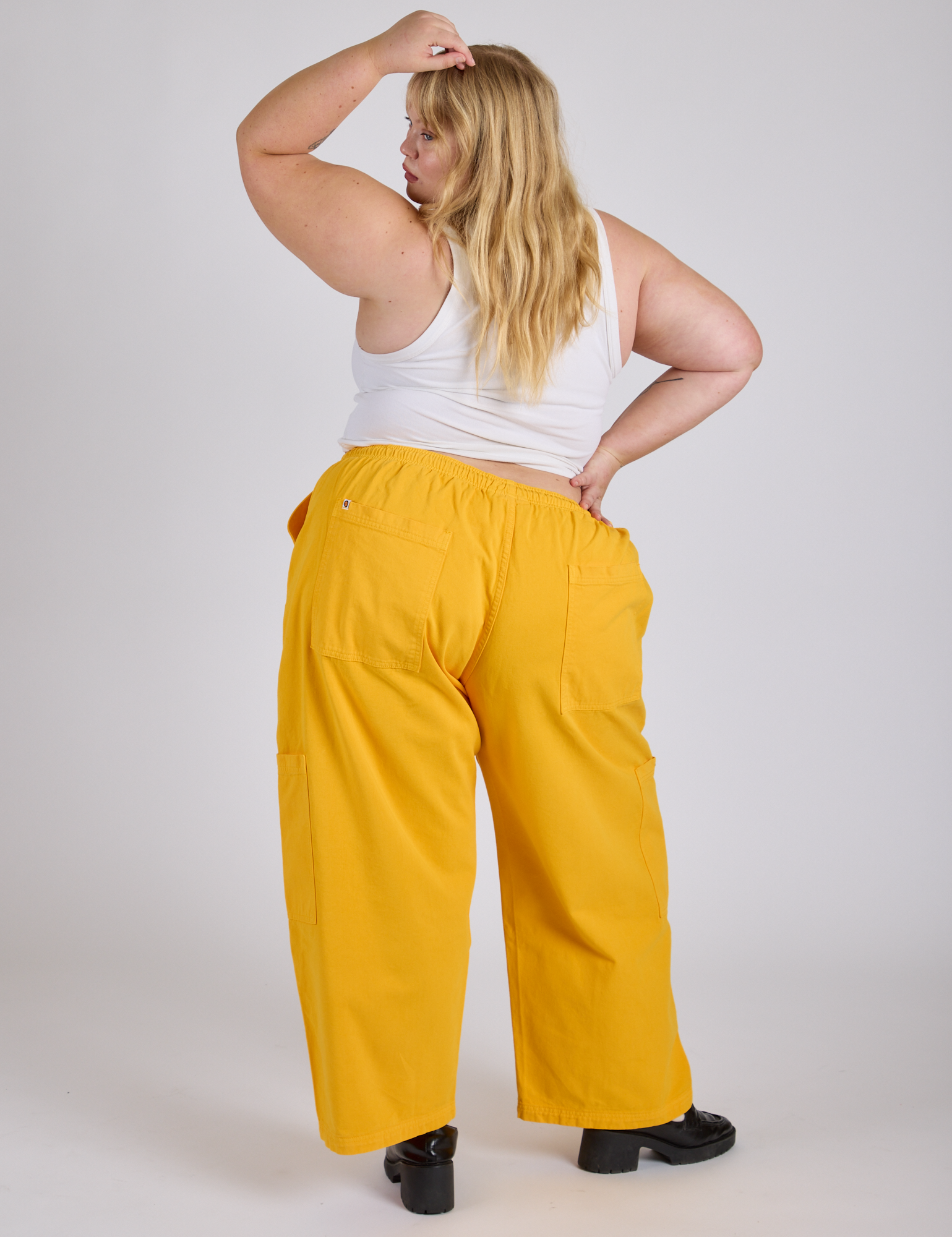 Drop Pocket Cargo Pants in Sunshine Yellow back view on Juliet
