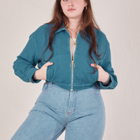 Ricky Jacket in Marine Blue worn by Sydney. She has both hands in the front pockets of the jacket.