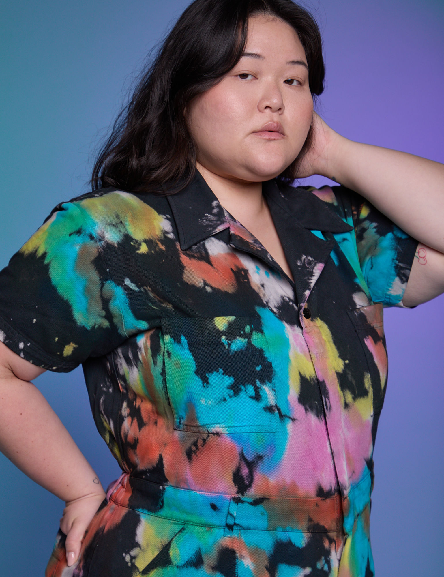 Short Sleeve Jumpsuit in Rainbow Magic Waters close up on Ashley