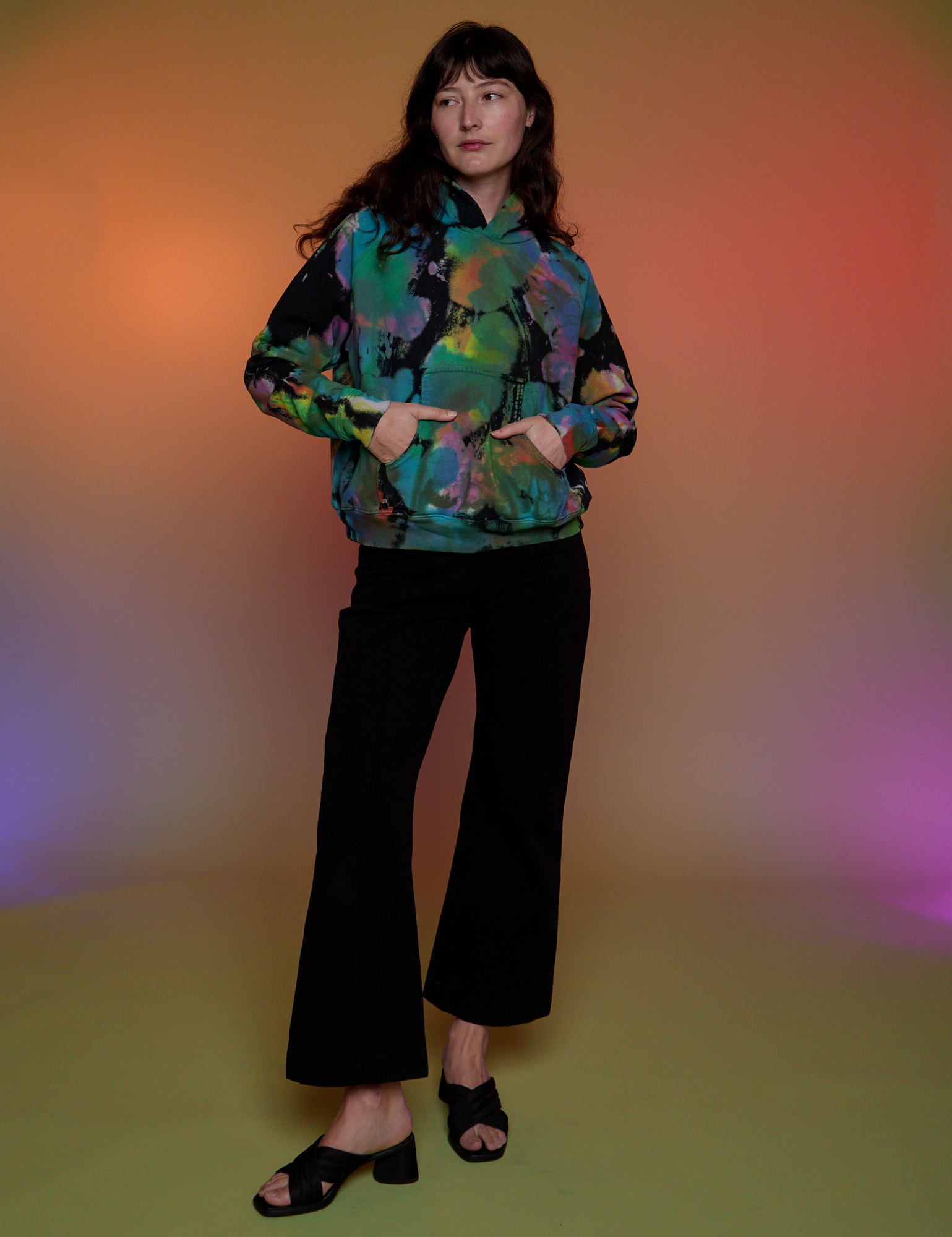 Alex is wearing Oversized Hoodie in Rainbow Magic Waters 