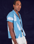 Soda Bottle Pantry Button-Up in Greek Blue side view on Jerrod