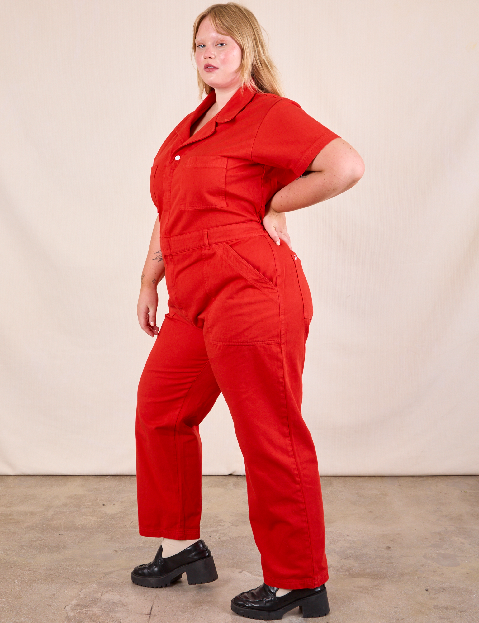 Short Sleeve Jumpsuit in Mustang Red side view on Juliet