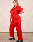 Short Sleeve Jumpsuit in Mustang Red side view on Juliet