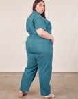 Angled back view of Short Sleeve Jumpsuit in Marine Blue worn by Marielena