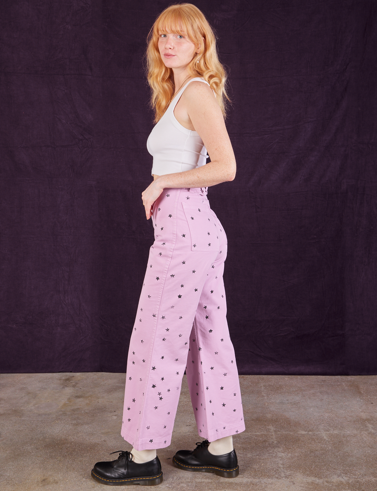 Side view of Star Bell Bottoms in Lilac Purple and Cropped Tank in vintage tee off-white on Margaret